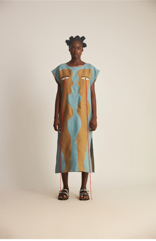 WUMAN FIGURES TEAR MOTIF TUNIC